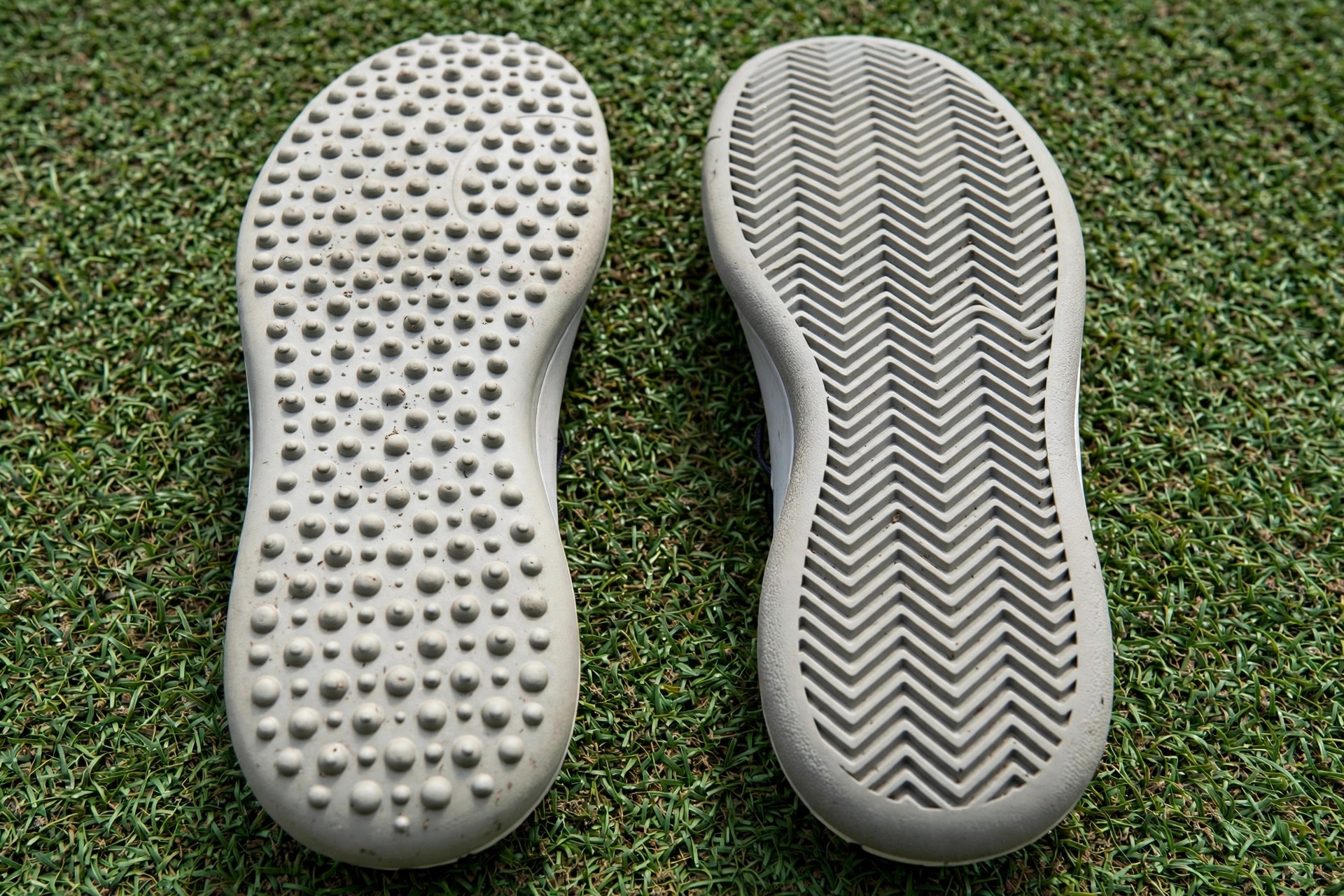 Herringbone and pimpled omni outsole patterns compared on astro turf